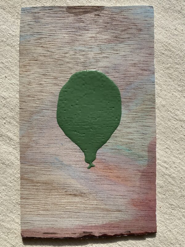 Green Lacquered Balloon floating in Smokey Desert Skies Cover