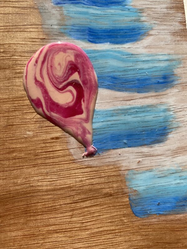 Pink Purple Swirl Balloon against Sandy Skies Cover