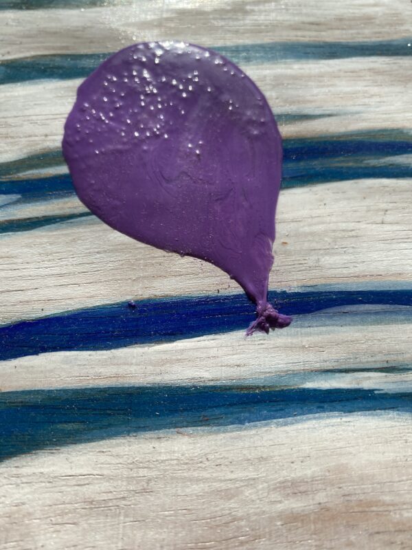 Purple Balloon Softly against Streaked Stark Skies Cover