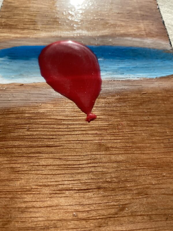 Red Balloon along Sand Puddled Skies Cover